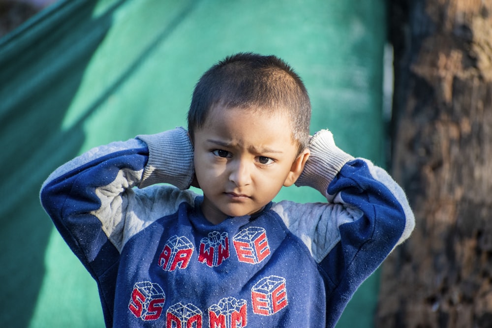 boy in blue and red hoodie