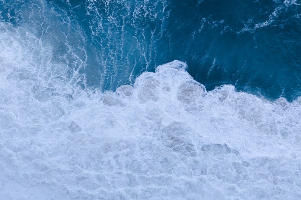 white and blue ocean waves