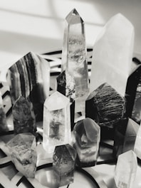 A collection of polished crystals glowing softly on a mossy surface.