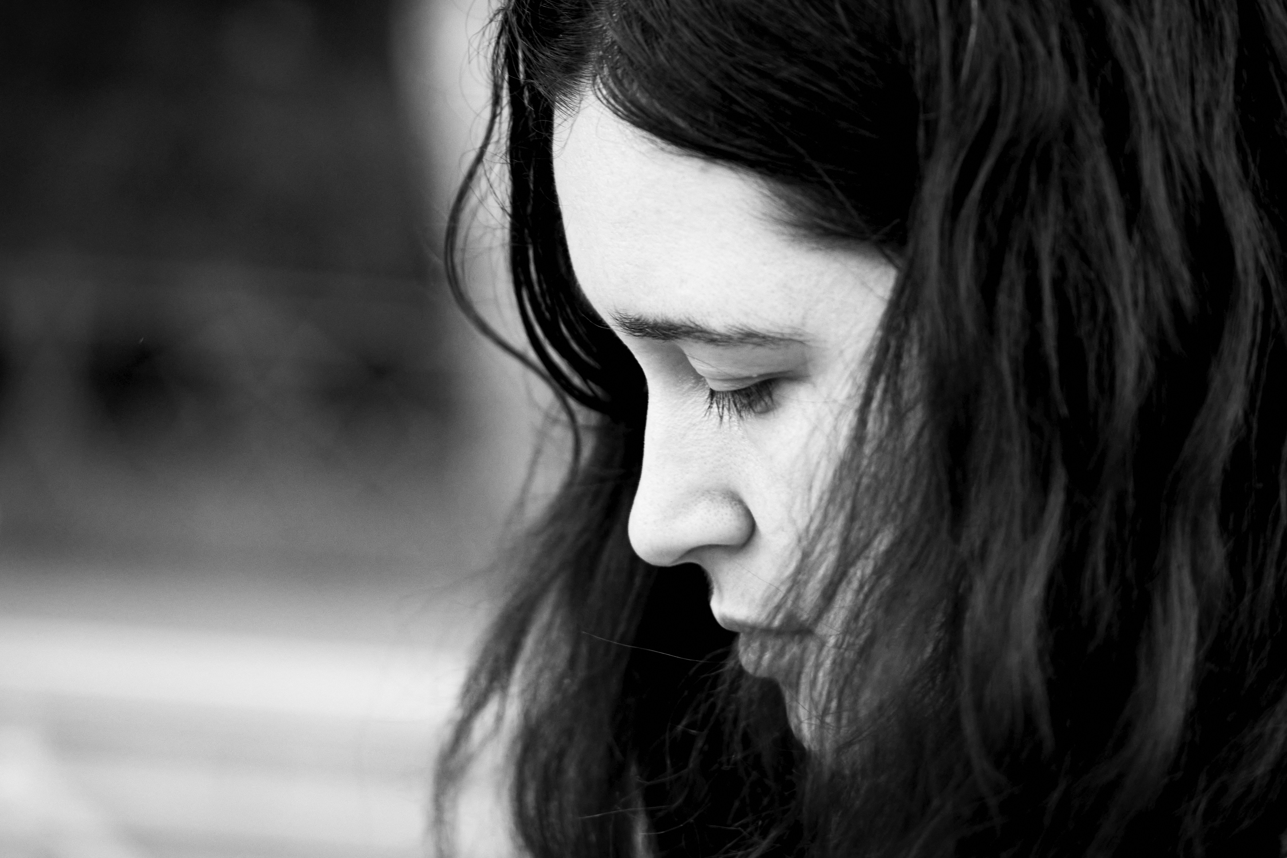grayscale photo of womans face