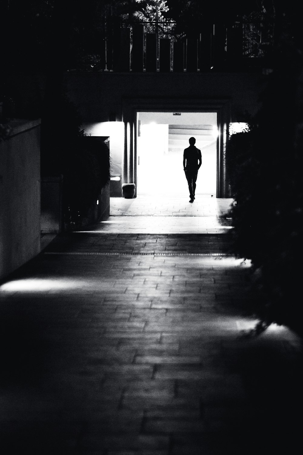 silhouette of person walking on hallway