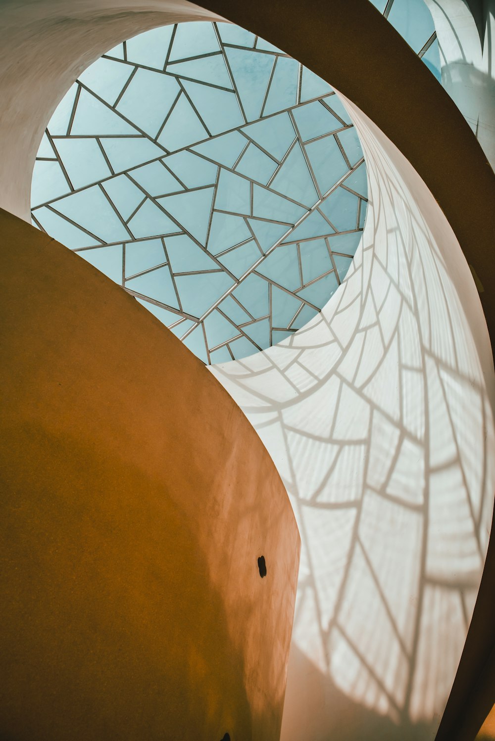 a building with a circular window and a skylight
