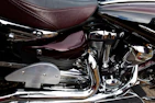 A close-up of a motorcycle engine with shining chrome details