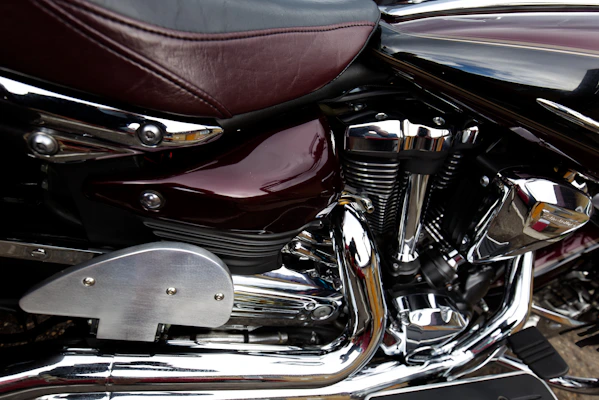 Close-up of a powerful motorcycle engine with shining metal parts.