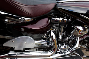 Close-up of a Honda motorcycle's engine showcasing its polished chrome details
