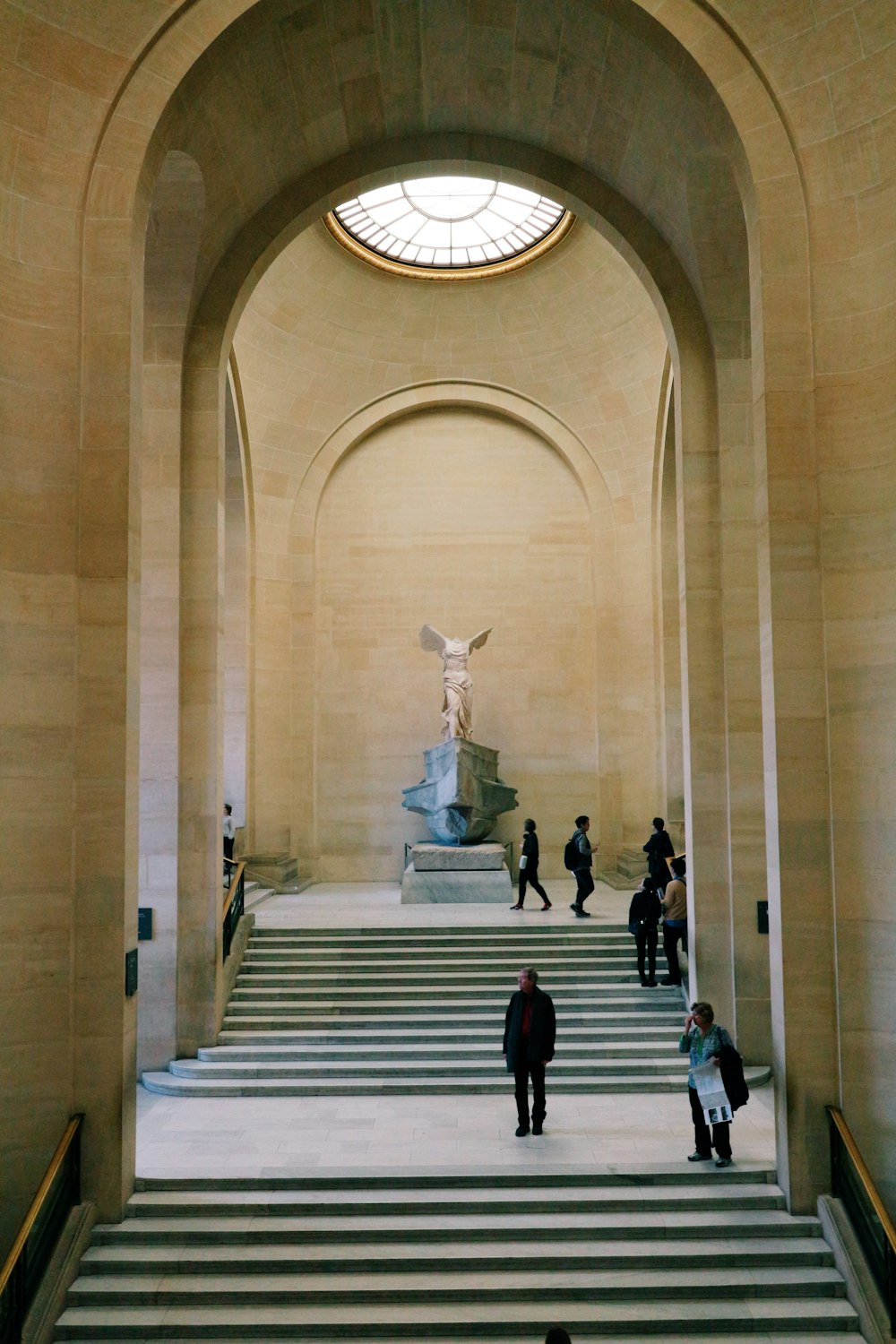 people walking on white concrete building