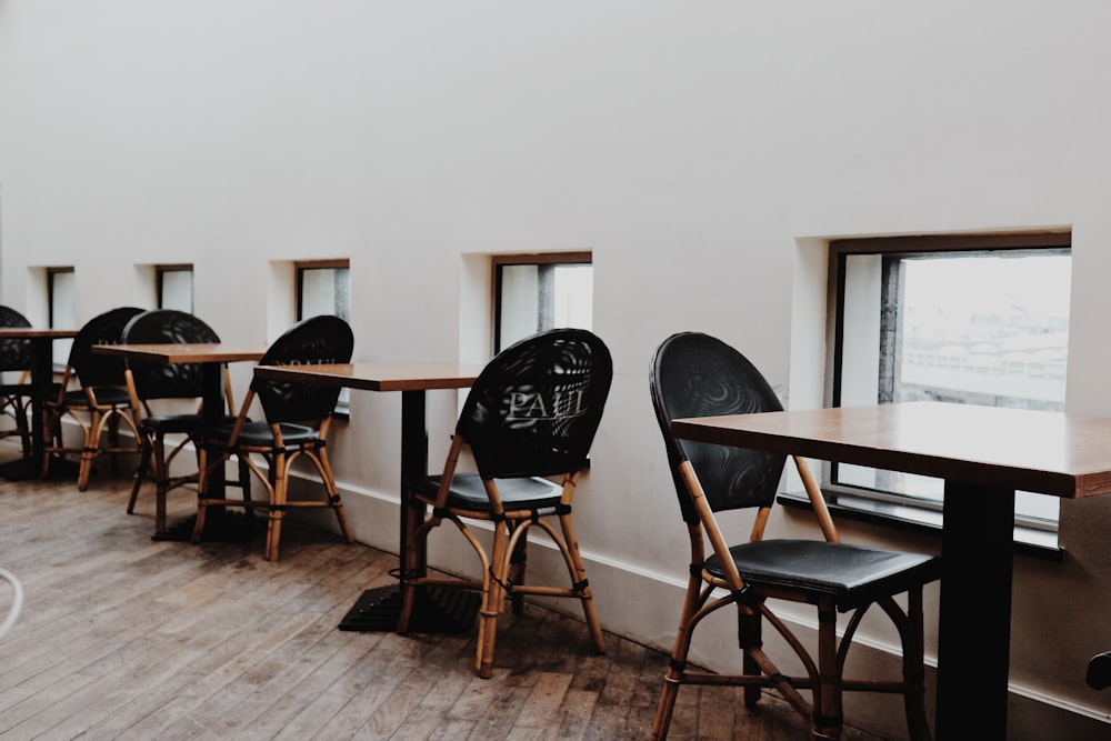 black and brown wooden table and chairs