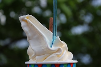 white ice cream on cone