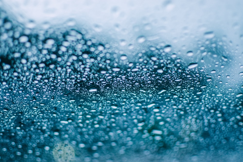 water droplets on blue surface