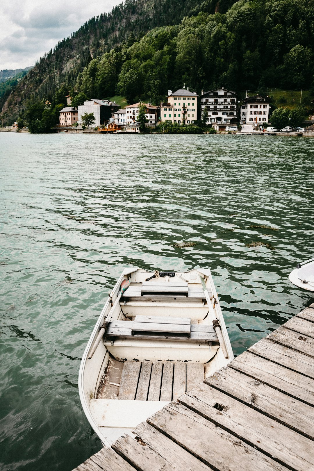 white boat on body of water during daytime