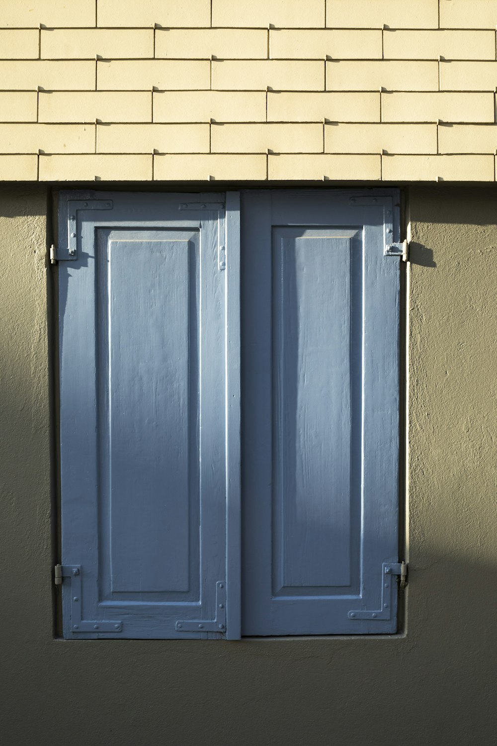 blue wooden door with silver handle