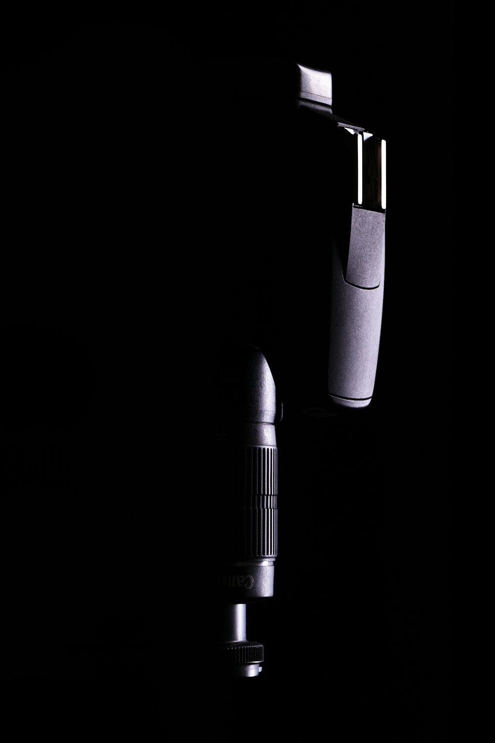 black and silver microphone with white background