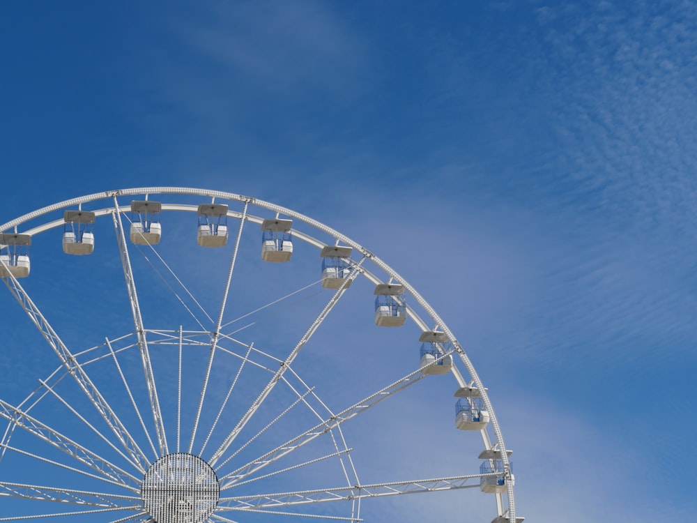 white ferris wheel under blue sky during daytime