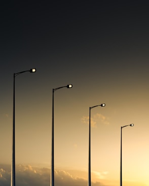 3 light post light turned on during night time