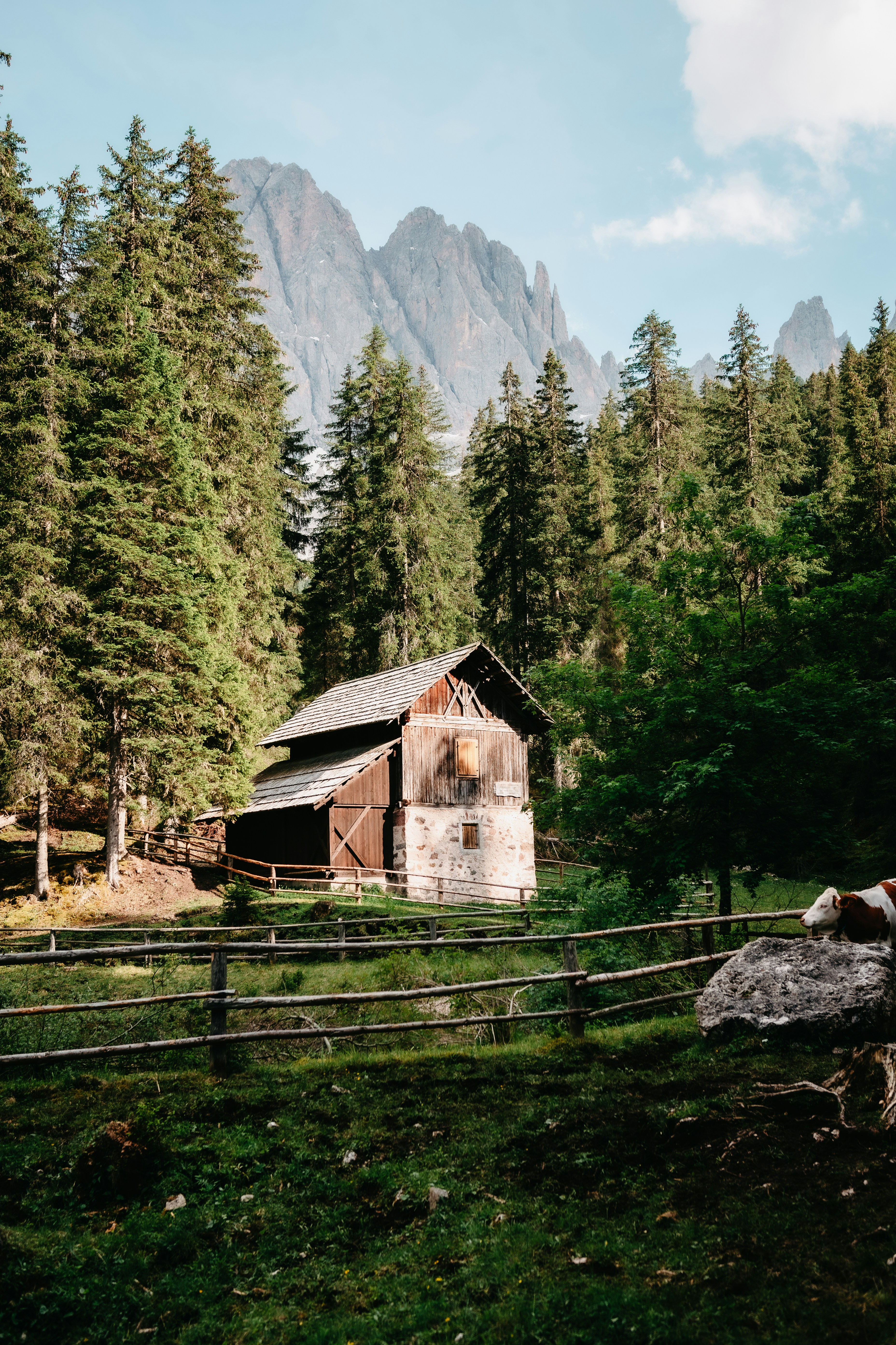 Brown wooden house near green trees and mountain during daytime photo ...