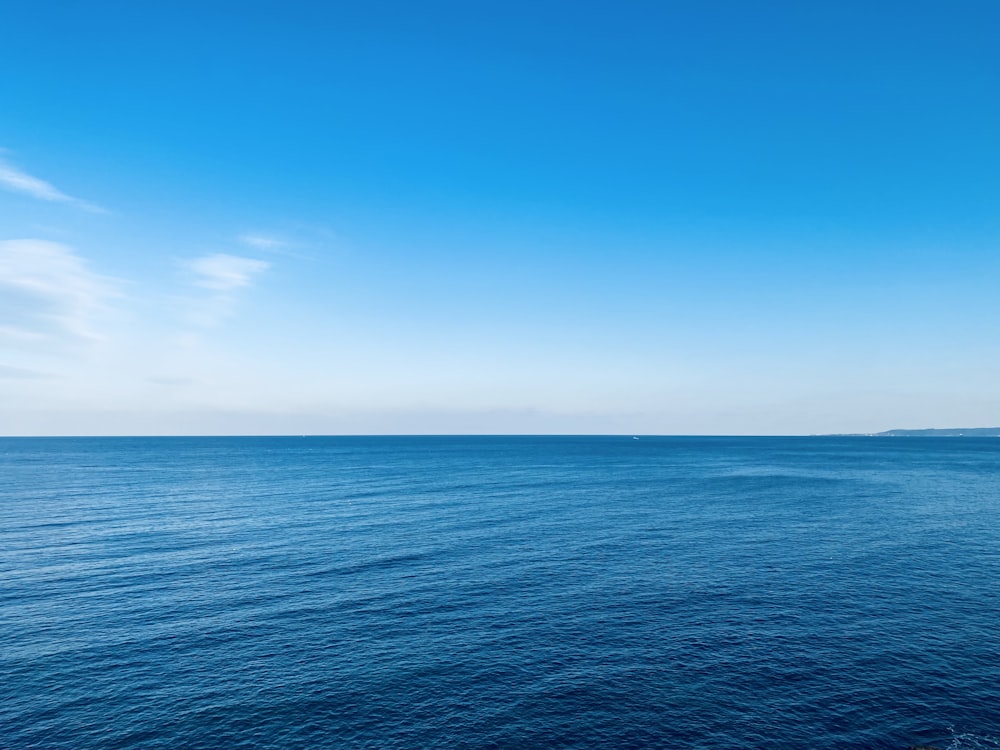 blue ocean under blue sky during daytime