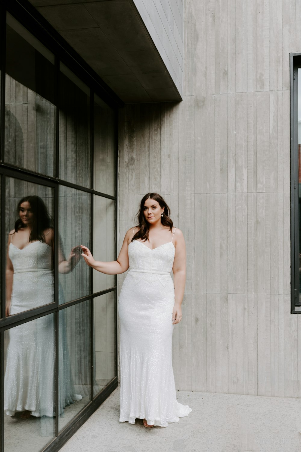 woman in white tube dress standing beside woman in white tube dress