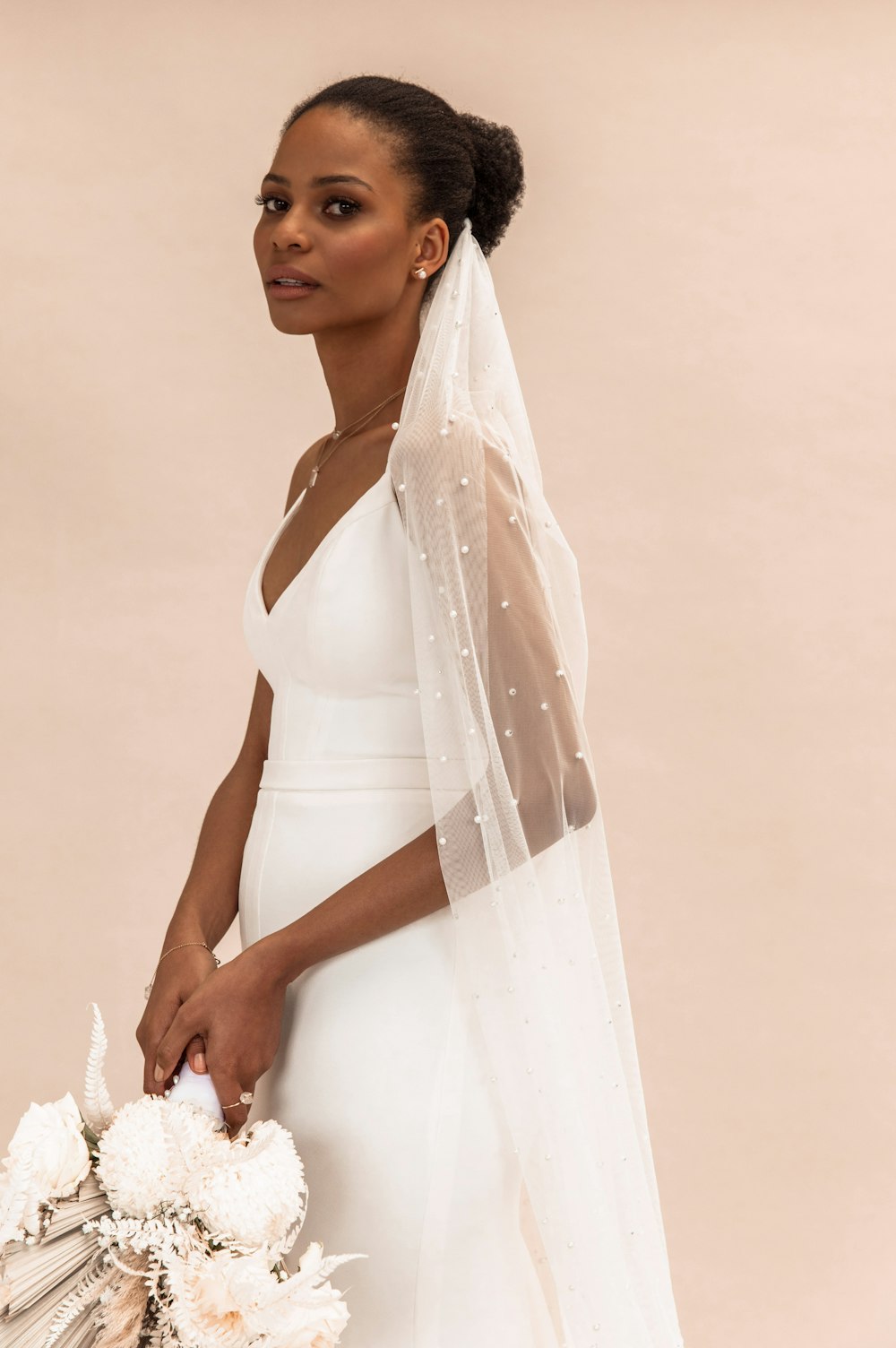 woman in white sleeveless dress