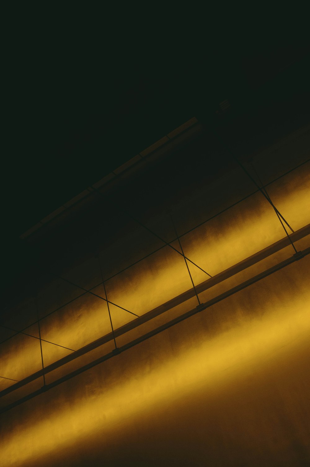 yellow lights on brown wooden ceiling