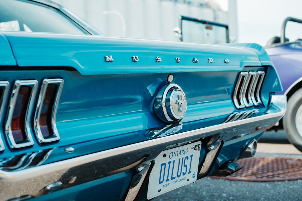 blue chevrolet car in front of white building