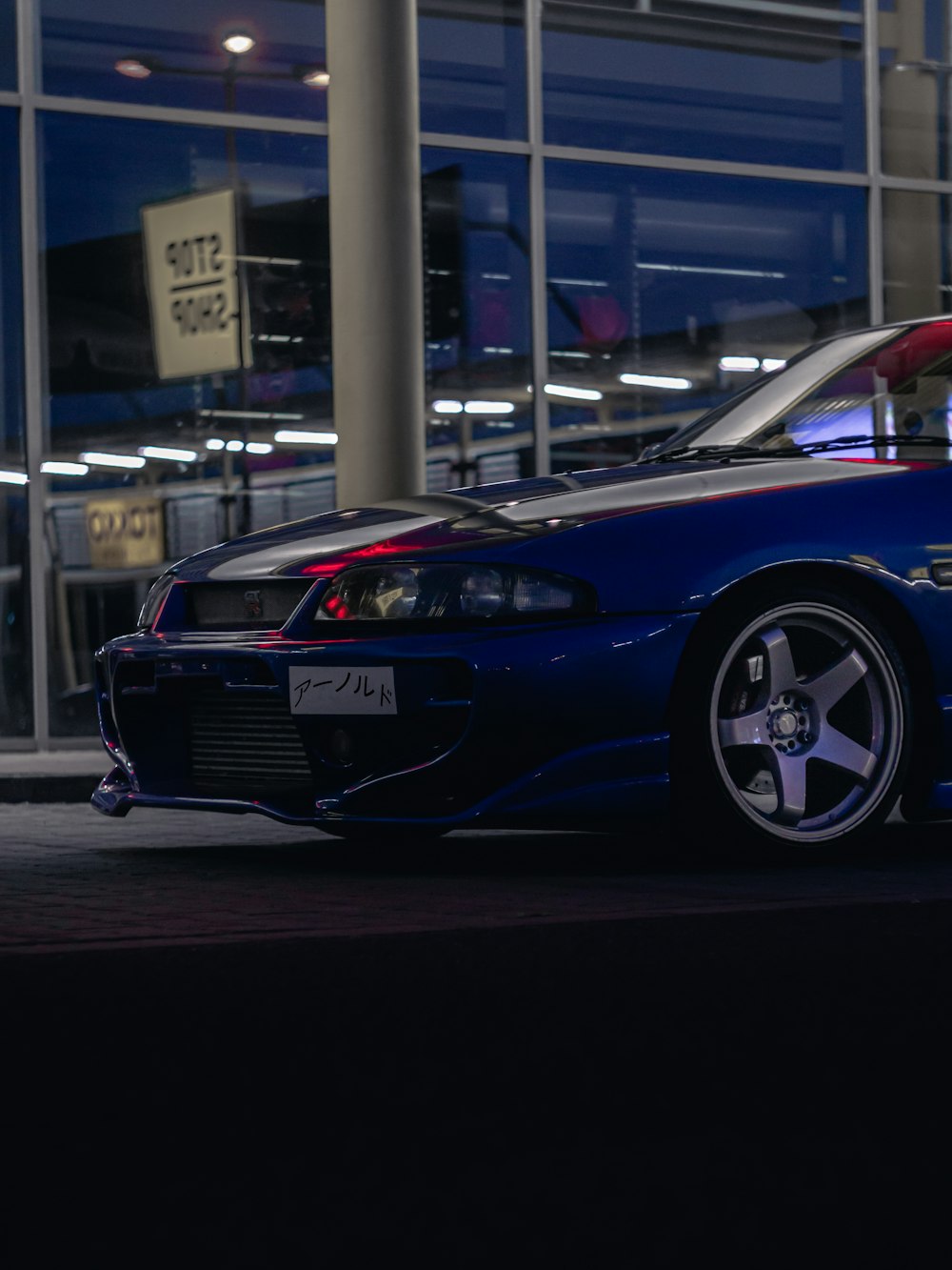 blue bmw m 3 parked on parking lot during daytime