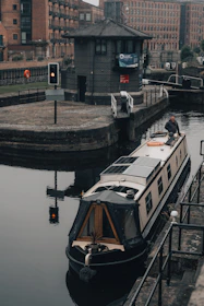 white and black boat on water