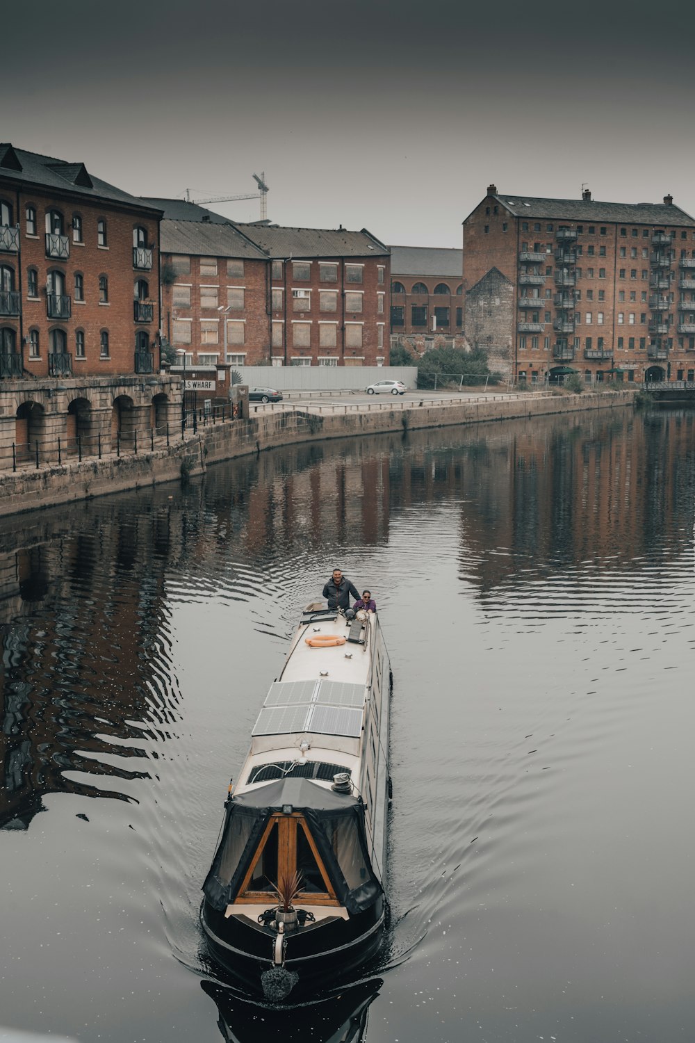 white and black boat on river during daytime