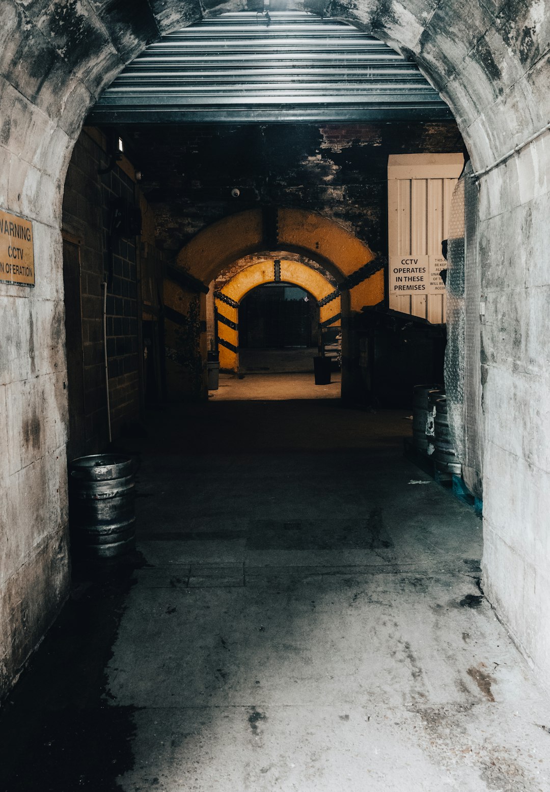 empty hallway with arch shaped tunnel
