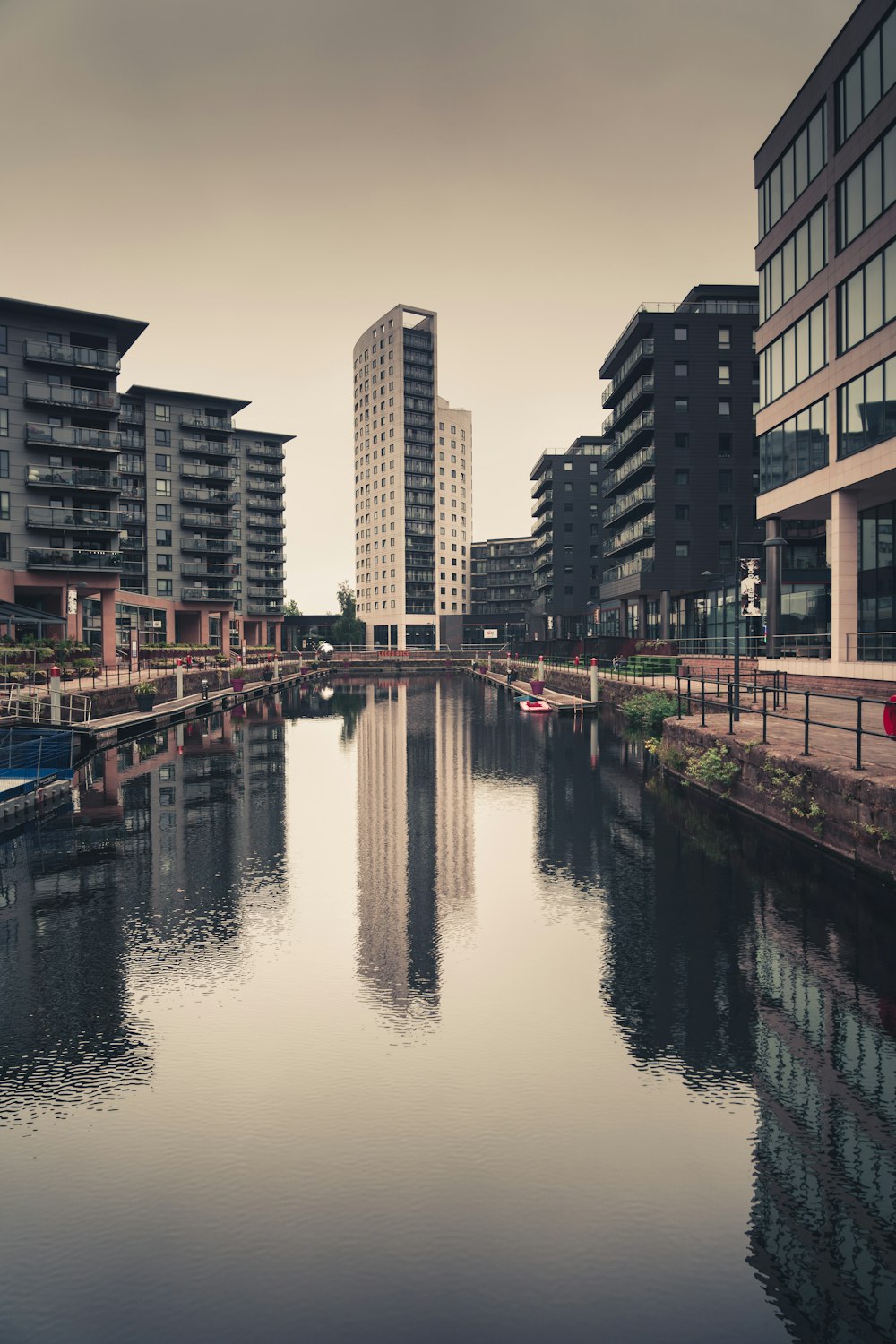 body of water between buildings during daytime