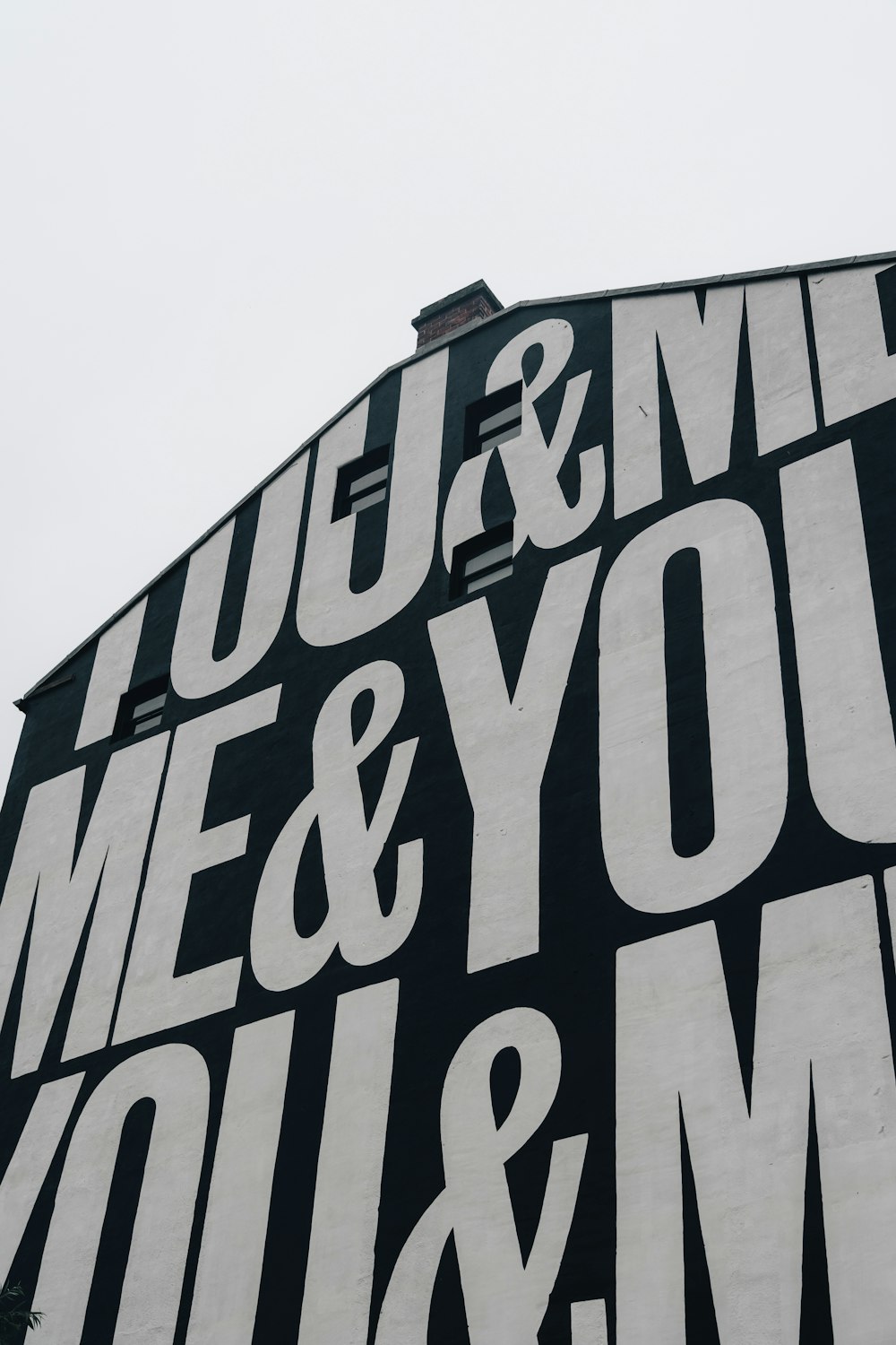 a black and white sign that says you and me and you and me