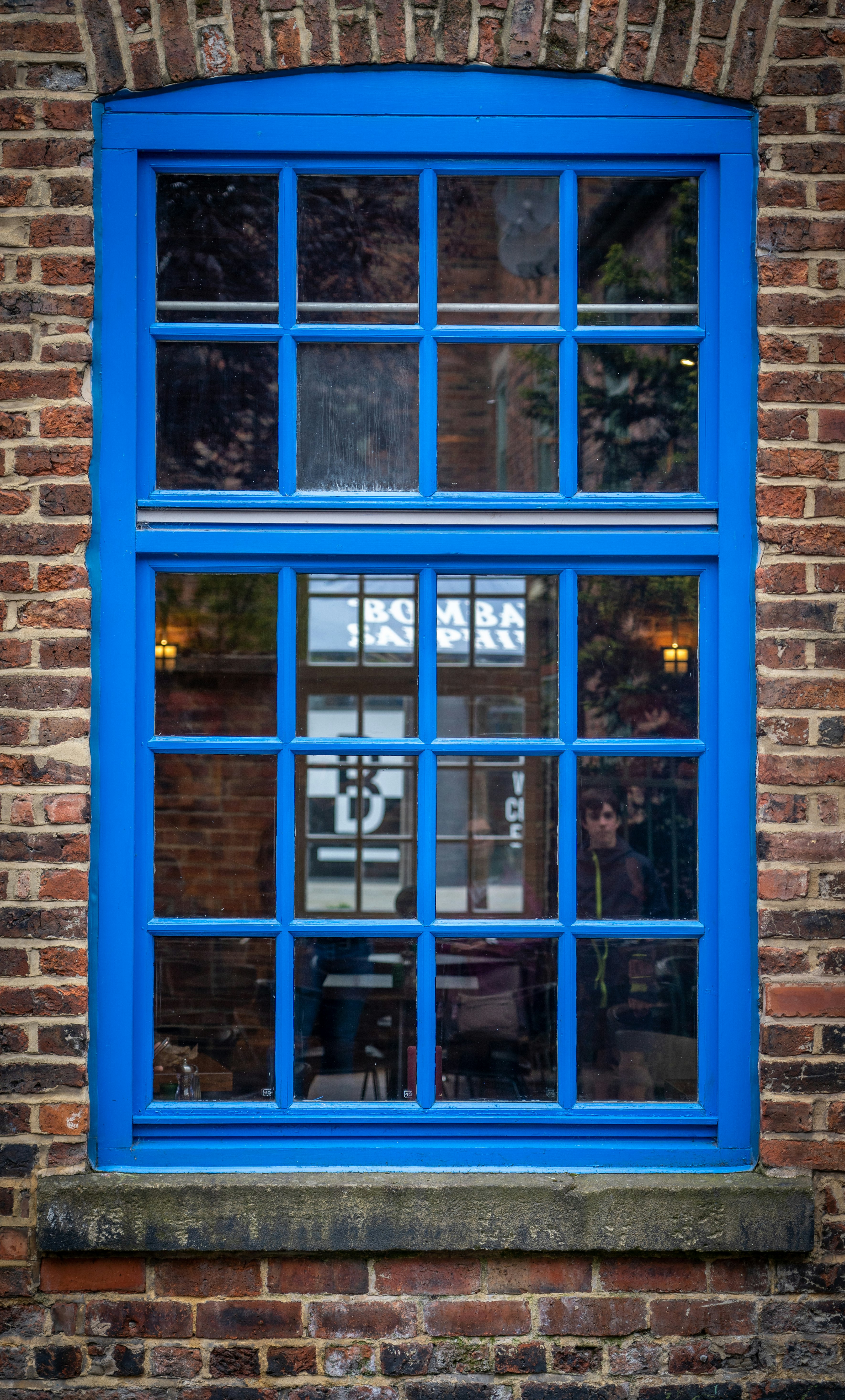 blue wooden framed glass window