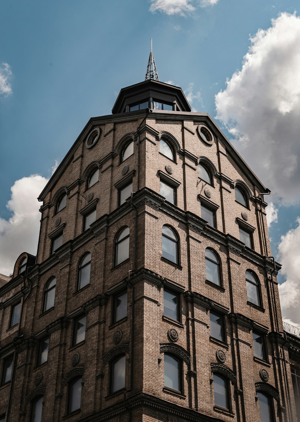 brown concrete building under blue sky during daytime