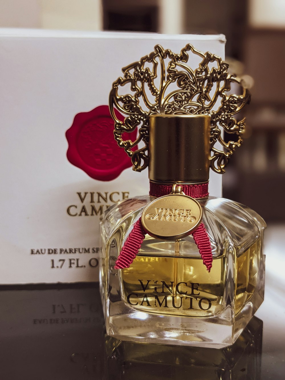 gold and red perfume bottle