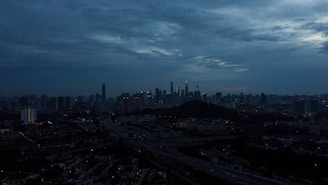 City skyline at dusk with network connection lines overlay.