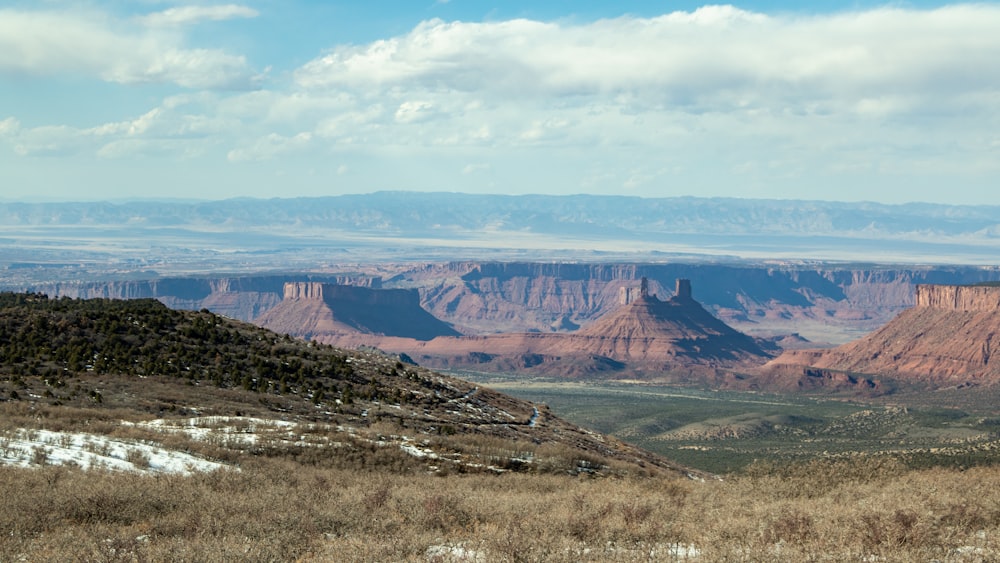 brown and green mountains under blue sky during daytime