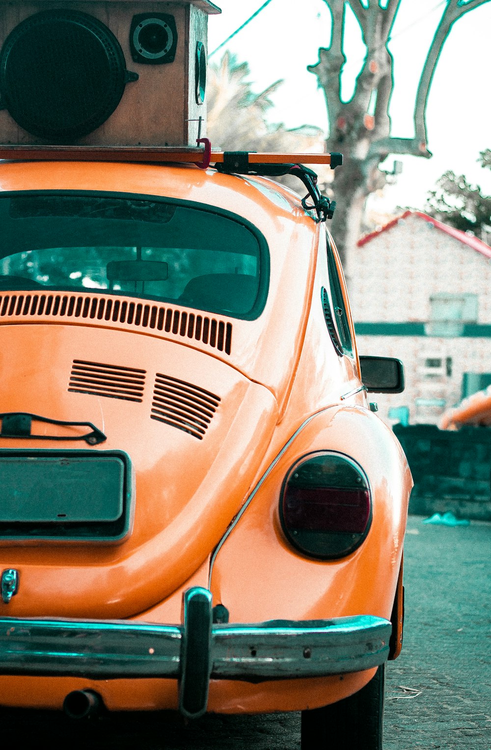 orange and black car on the street