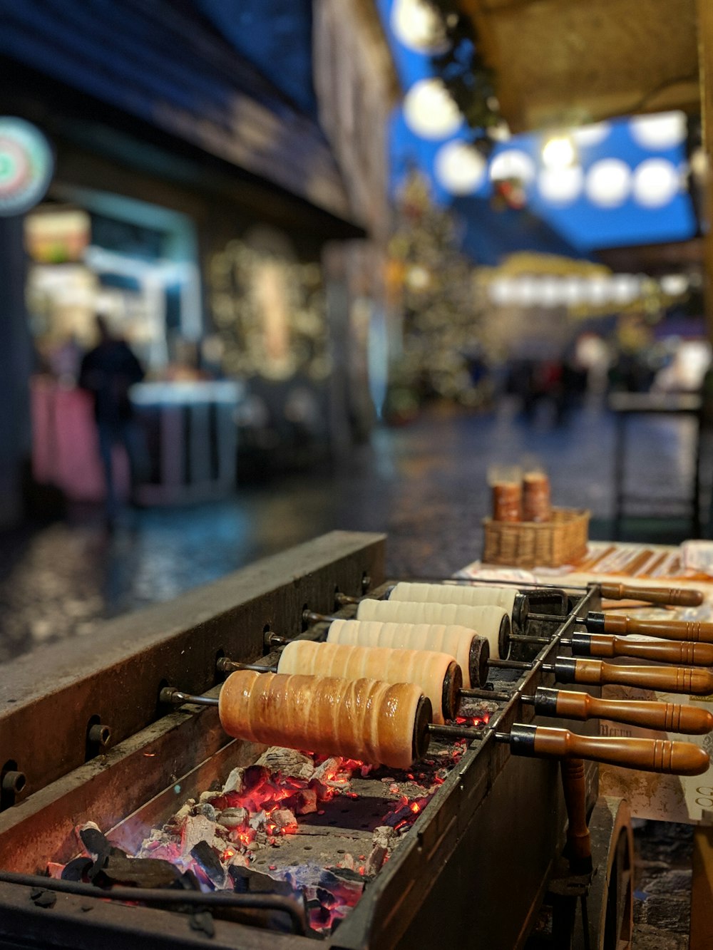 selective focus photography of candles on wooden rack