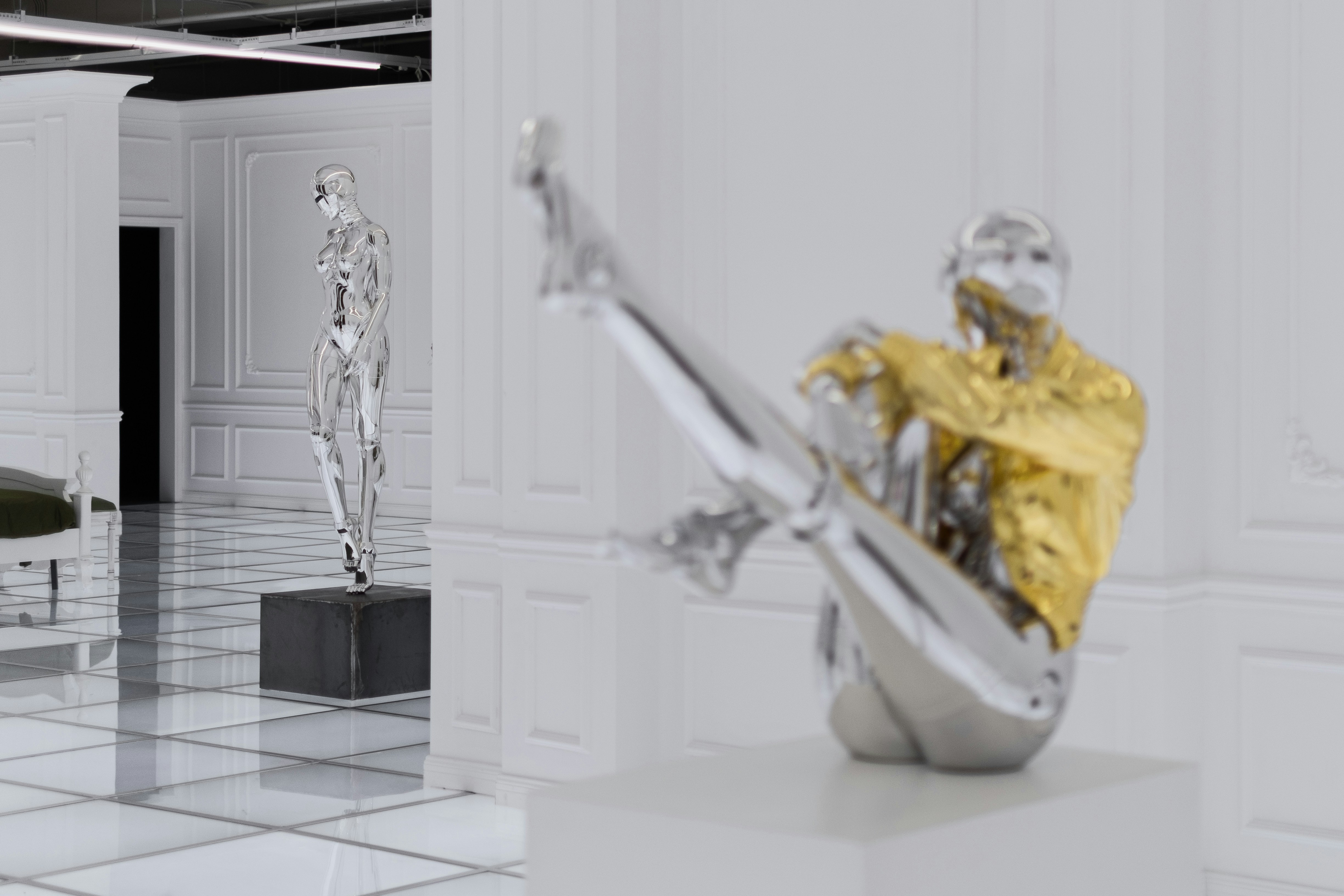 gold and white ceramic figurine