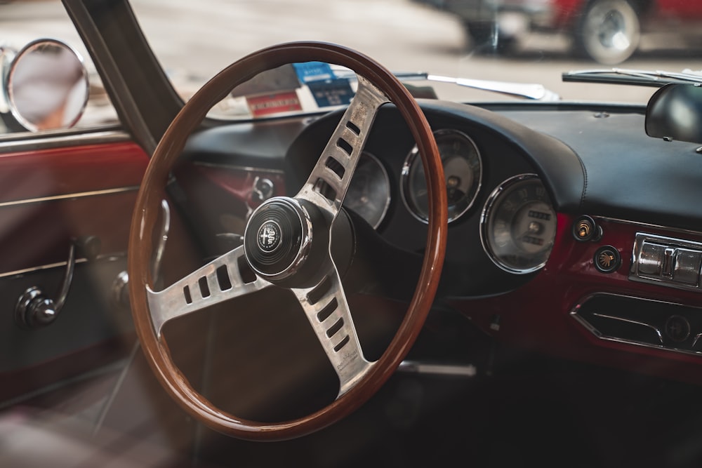 red and black car steering wheel