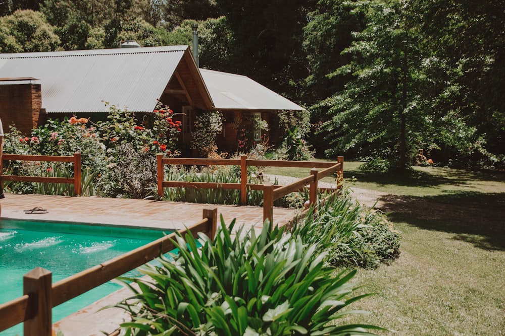 brown wooden gazebo near swimming pool during daytime