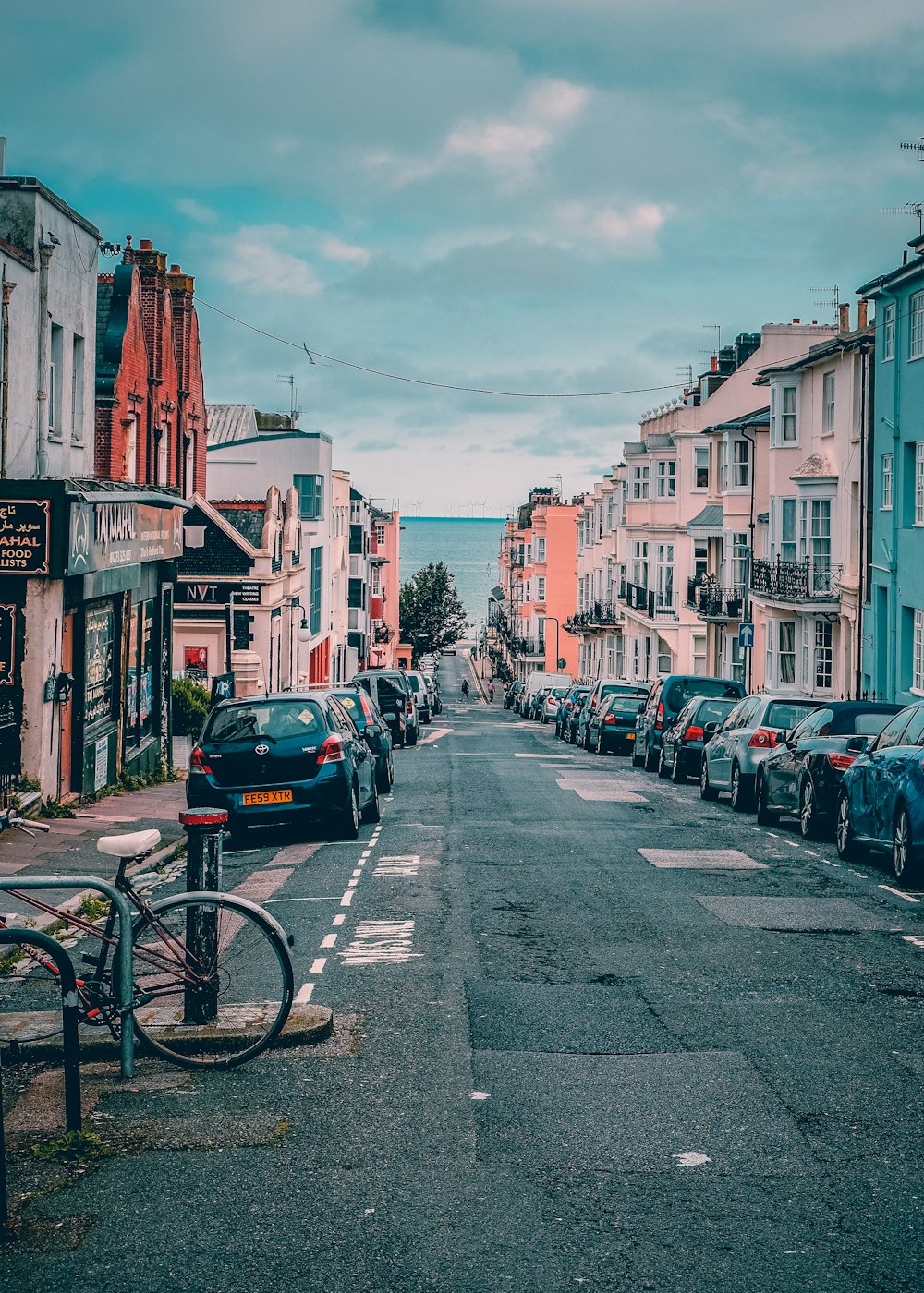 cars parked on street near buildings during daytime