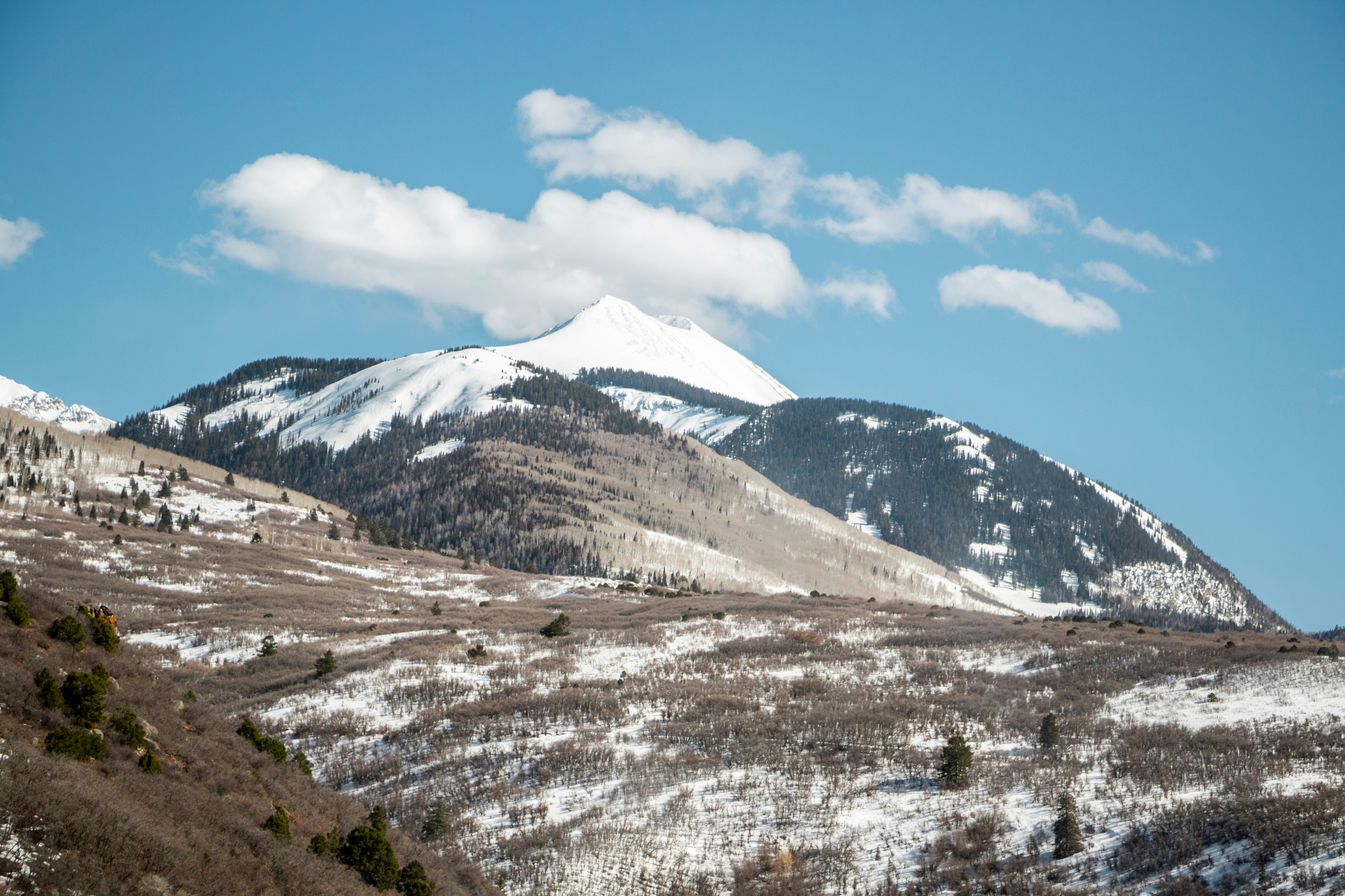 snow covered mountain under blue sky during daytime