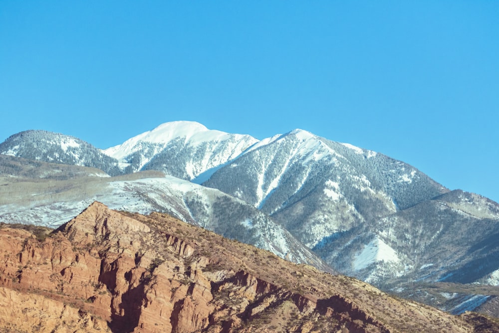 brown rocky mountain under blue sky during daytime