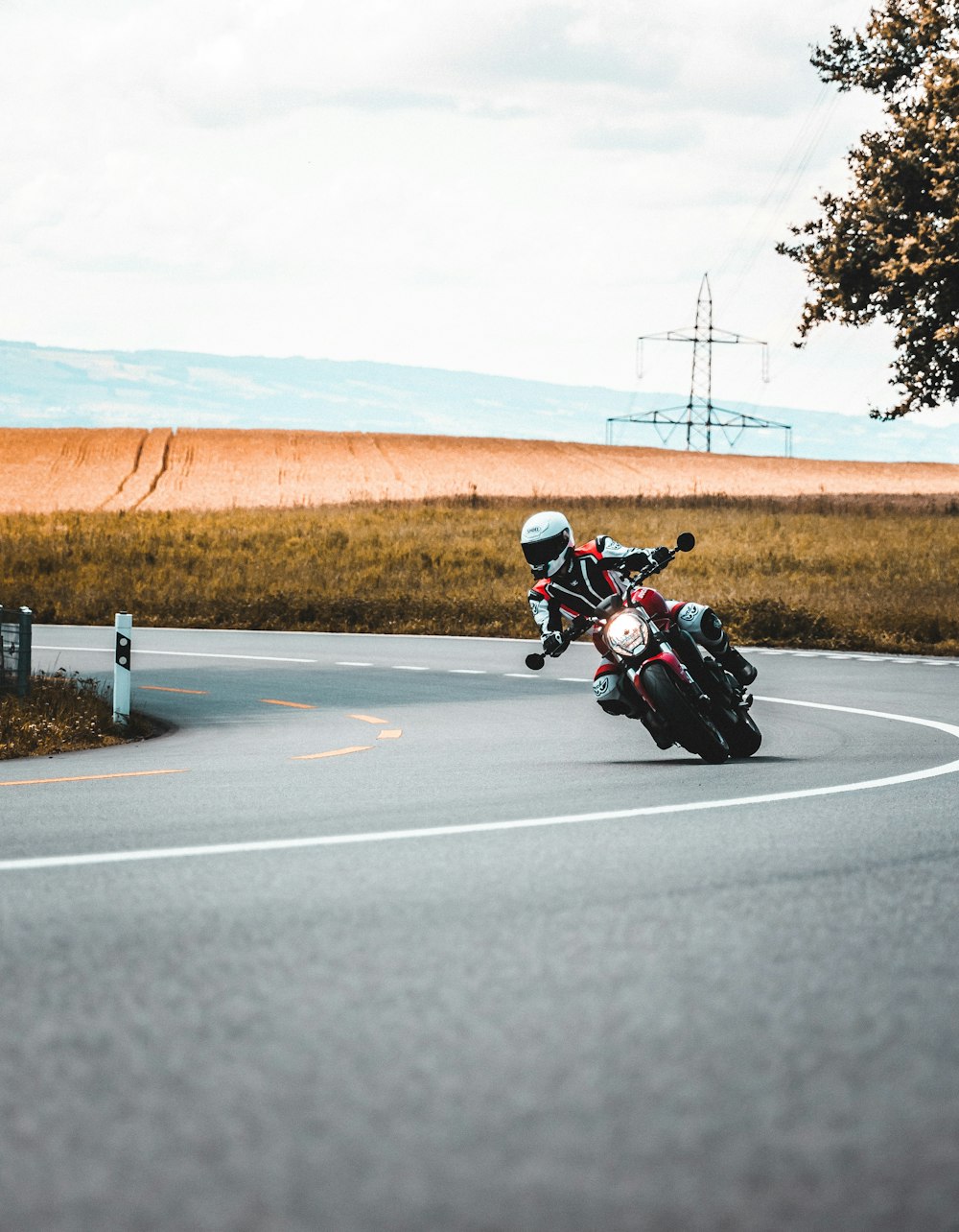 man in black jacket riding motorcycle on road during daytime