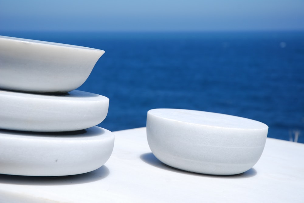 white ceramic bowl on white table