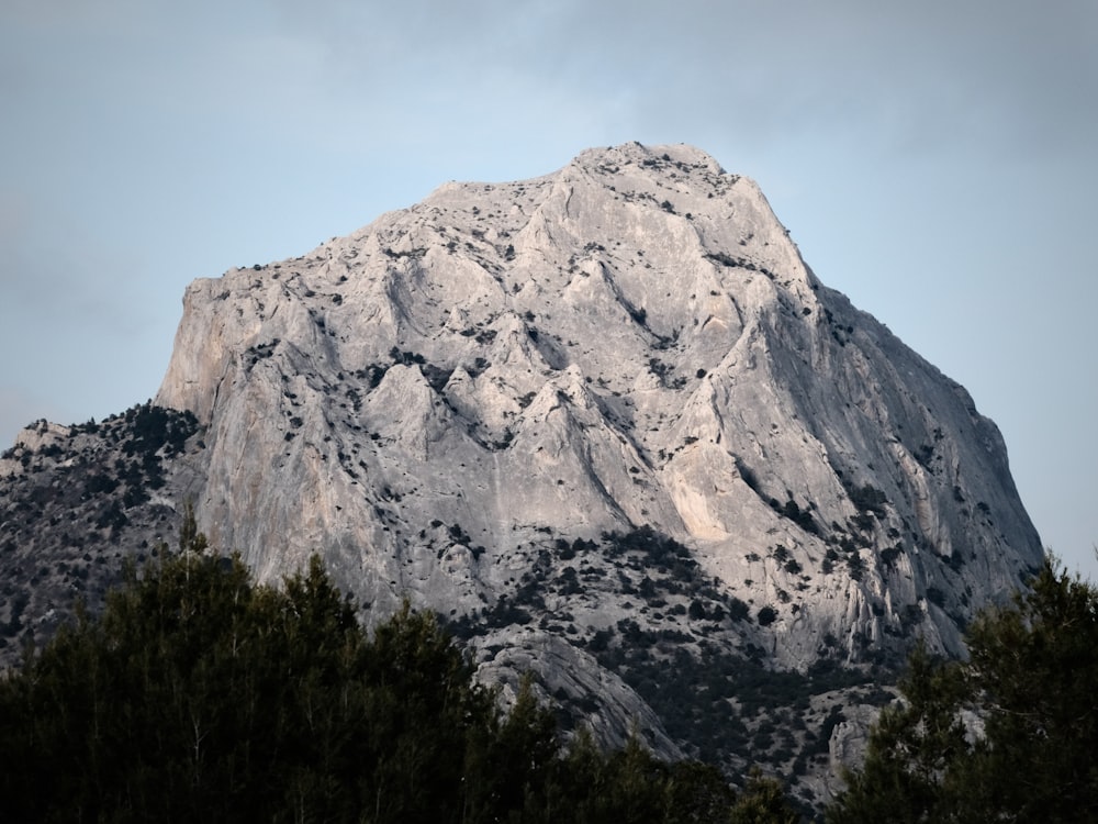 gray rocky mountain under blue sky during daytime