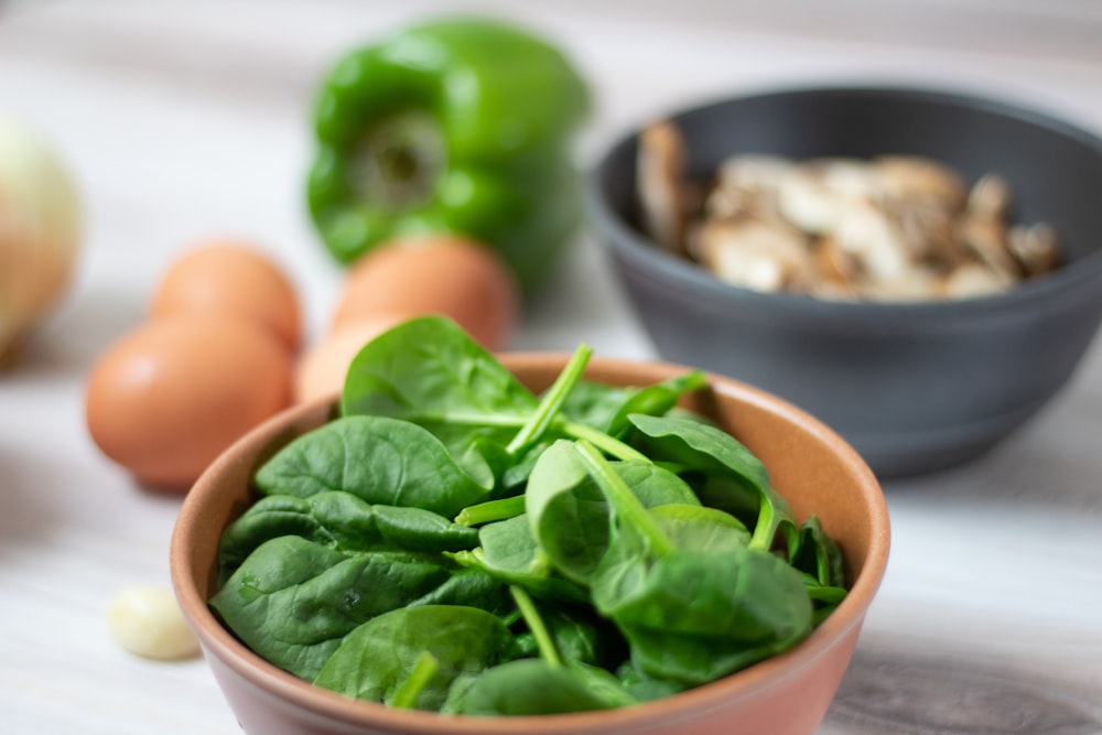 green vegetable on white ceramic bowl