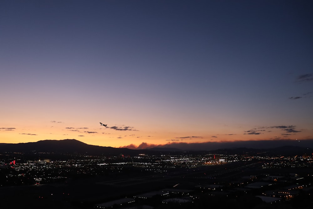 silhouette of city during sunset