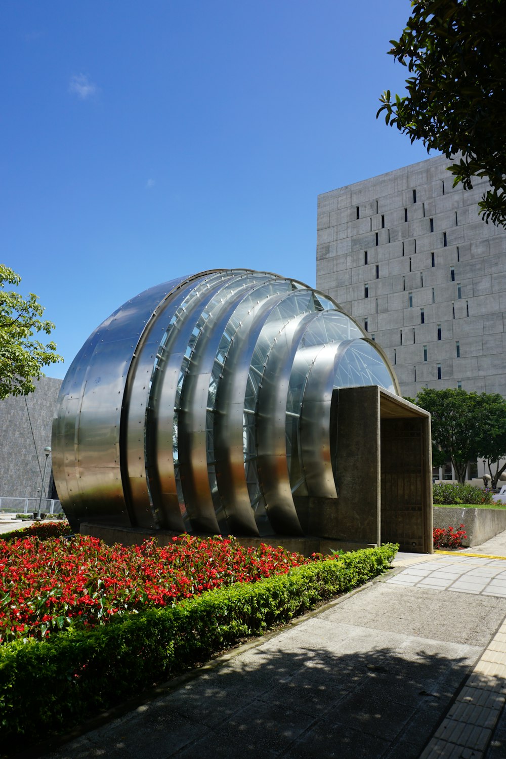 silver round ball on gray concrete floor