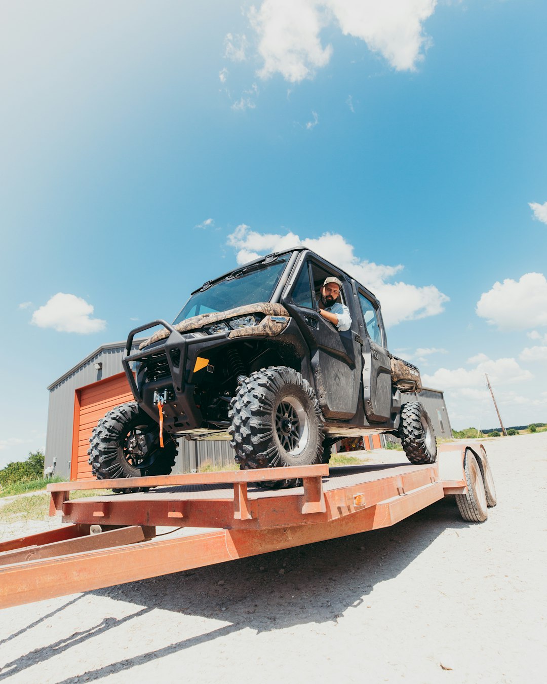 black jeep wrangler on brown wooden platform under blue sky during daytime